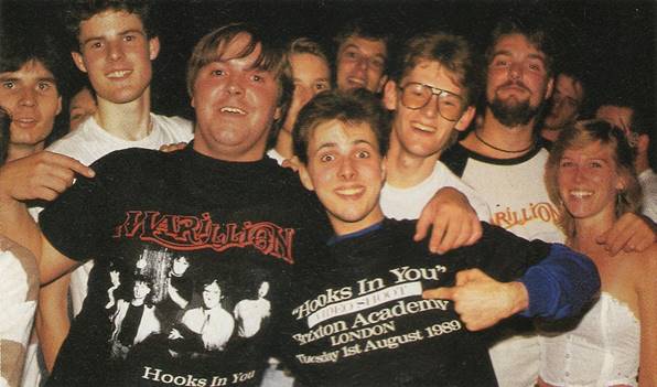 A group of people posing for a photo
Description automatically generated with medium confidence